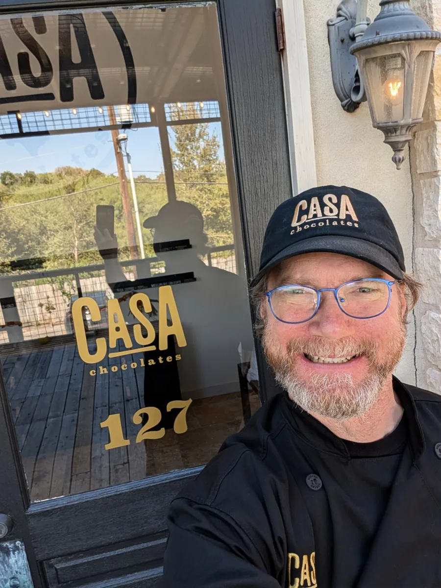 Derik Swee, owner and chocolate maker, at the door of Casa Chocolates